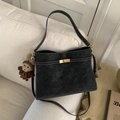 Black vintage shoulder bag with white stitching, gold lock and crochet bear charm - Black with Pendant