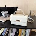 Minimalist cream white crossbody square bag with silver metal swivel lock and top handle - White