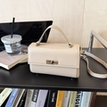 Chic cream white leather crossbody bag with metal twist lock for office and daily wear - Khaki
