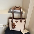Minimalist beige and brown tote bag with plush bear charm and slender shoulder straps - Off-White (With Pendant)