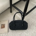 Minimalist black oval top-handle bag with glossy spherical accents and matte finish - Black without Pendant