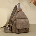 Detail of vintage brown soft leather chest bag with gold twist lock and JINGPIN logo - Brown