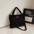 Bolso tote minimalista de lona negra con parche de cuero de moda y correa de hombro - Negro