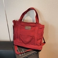 Bolso tote retro de lona roja con bolsillo frontal y correa ajustable para uso diario - Burdeos