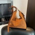 Brown faux suede hobo bag featuring decorative wooden beads and tassel detail - With Charm / Brown