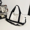 Grande borsa da viaggio sportiva bicolore bianco e nero con tracolla regolabile - Bianco