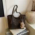 Dark brown matte tote bag with adjustable strap and plush bear charm on a silver suitcase - Coffee with Pendant