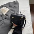 Classic black faux leather square handbag with gold buckles and adjustable strap - Black