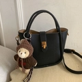 Black pebble leather bucket bag with gold clasp and cute brown bear charm accessory - With Pendant / Black