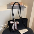 Minimalist black woven tote bag with slim shoulder straps and printed silk scarf detail - Black