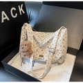 Close-up of cream corduroy tote bag with heart patterns and plush bear charm in a gift box - Cream White With Pendant