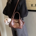 Brown pleated dumpling bag with gold lettering, crossbody strap and cute bunny pendant - With Charm / Brown
