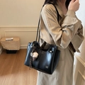 Classic black leather tote bag with vintage charms and minimalist white logo lettering - Black with Pendant