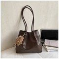 Detailed view of deep brown large tote bag with cute plush bear charm on minimalist background - With Charm / Brown