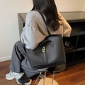 Minimalist black pebble leather tote bag with elegant gold metal twist lock buckle - Black