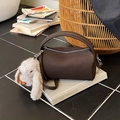 Dark brown cylindrical crossbody bag with lychee texture and cute plush rabbit charm - With Charm / Brown