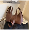 Detail of brown litchi pattern leather shoulder bag with adjustable silver buckle strap - Brown