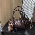 Dark brown glossy shoulder bag featuring golden lock and knit bear pendant charm - Coffee with Pendant
