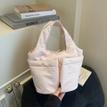 Light pink fabric tote bag with multiple pockets and a soft minimalist canvas design - Pink
