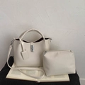Detail of cream pebbled leather bucket bag set with silver metal clasp and inner pouch - 2-in-1 Bag Set / White