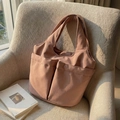 Dusty pink nylon tote bag with front pockets on a soft beige woven armchair - Dusty Pink