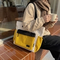 Contrast color travel tote bag with large zipper pocket and drawstring side pouches - Yellow