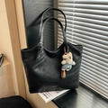 Black large leather tote bag with a cute bear charm and fashion text detail - Black