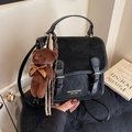 Black dual-use backpack with flap buckle and brown plush bear charm in vintage style - With Charm / Black