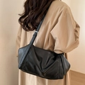 Chic black pleated shoulder bag in soft faux leather with adjustable strap and silver buckle - Black