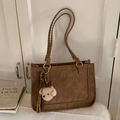 Brown faux suede underarm bag with woven handles and a cute plush dog pendant - Khaki