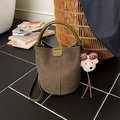 Dark green matte leather bucket bag with plush bear charm and crossbody strap - With Charm / Green