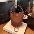 Brown faux suede bucket bag with dark leather handle and cute white teddy bear charm - With Charm / Brown
