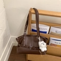 Retro deep brown tote bag with pebble leather texture and a cute plush dog pendant - Brown