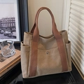 Khaki canvas tote bag with brown woven handles and convenient metal snap front pocket - Khaki