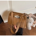 Detail of tan faux leather square shoulder bag featuring metal twist lock and bunny charm - Khaki With Pendant