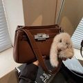 Minimalist dark brown leather square shoulder bag with plush rabbit charm and silver buckle - Brown with Pendant