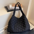 Chic black quilted puffer tote bag with soft texture and wide shoulder strap - Black