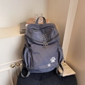 Dunkelgrauer Rucksack mit großer Kapazität, Pfotenstickerei und dezenter Karotextur im Detail - Dunkelgrau