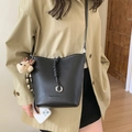 Black litchi grain leather bucket bag with drawstring detail and cute bear charm - Black with Pendant