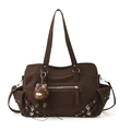 Retro large brown tote bag with silver rivets and plush monster charm in a front view - With Pendant / Brown