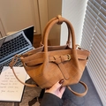Brown quilted crossbody bucket bag with leather straps and elegant metal buckle - Brown