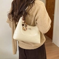 Creamy white quilted hobo bag with star charm and leather chain strap shown on model - With Charm / Off White
