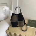 Retro color-block bucket bag in olive brown and black faux suede with gold logo plate - Dark Green