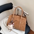 Brown suede tote bag with plush dog charm on a chair for commute and casual use - Brown with Pendant