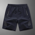 Dunkelblaue Herren-Sportshorts, schnelltrocknend, mit elastischem Bund und Reißverschlüssen - L / Dunkelblau