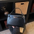 Minimalist black trapezoid handbag in oil wax leather with silver metal twist lock buckle - Black