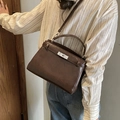 Classic dark brown vintage top-handle bag with silver metal buckle in a trapezoid shape - Brown