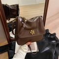 Brown vintage style handbag with gold flower clasp shown in front and back views - Brown
