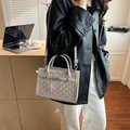 Light gray embossed Kelly style handbag with top handles and adjustable shoulder strap - Gray
