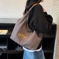 Minimalist dark grey canvas tote bag with yellow letter embroidery and leather shoulder straps - Dark Brown